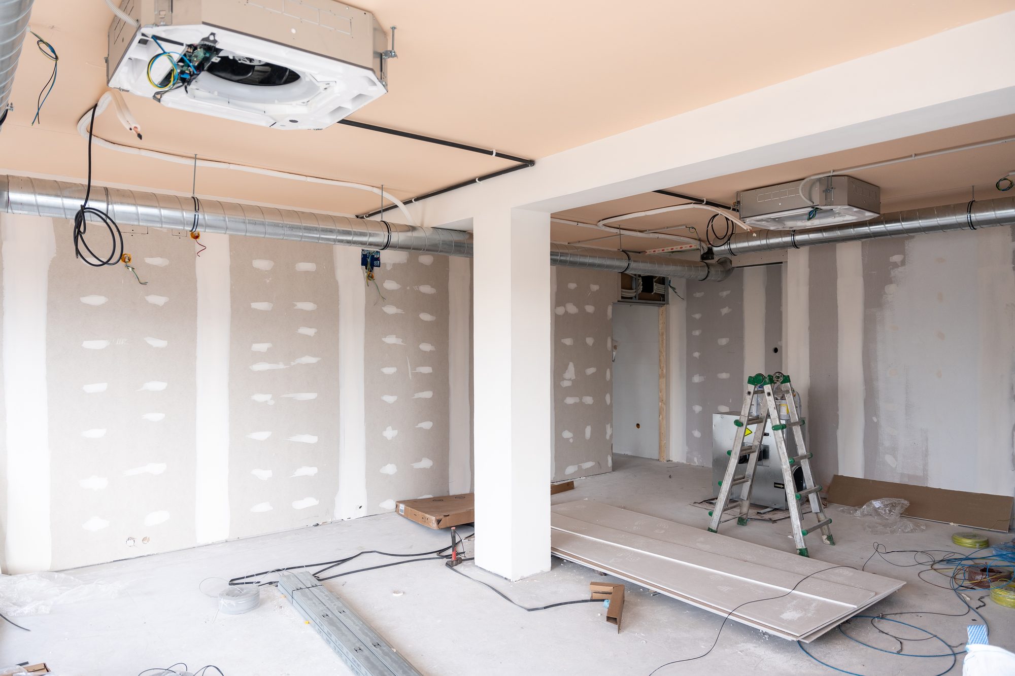 Electrical and mechanical rough-in during a remodel — wiring, conduit, and ductwork